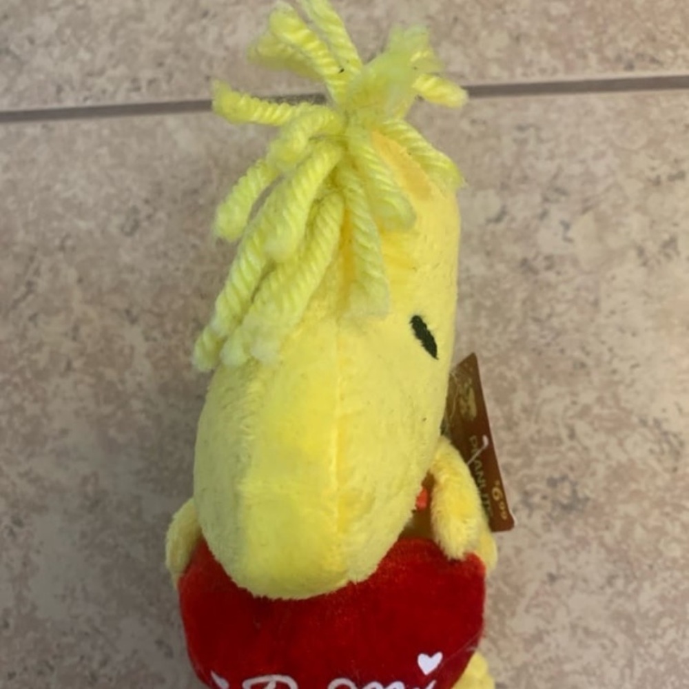 New! Woodstock plush toy from the Peanuts franchise, holding a red ❤️